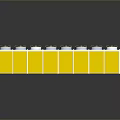 Industrial Equipment With Multiple Circular Components On Long Yellow And White Rectangular Frame