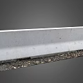 Concrete Curb With Surface Scratches Gravel And Grass At The Bottom