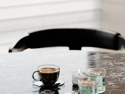 Modern Decorative Ornament Set with Coffee Cup Lit Candle and Glassware on Black Marble Tabletop 3d model