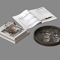 Open Magazine And Stacked Books With Wooden Tray And Glass Cups