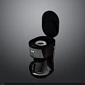 Black Electric Coffee Maker With Open Lid And Glass Carafe For Home Use