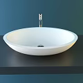 Sleek White Oval Countertop Washbasin With Modern Faucet On Dark Surface