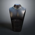 Silver Necklace Displayed On Black Mannequin Torso As Daily Living Accessory
