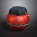 Red Spherical Weapon With Black Hexagonal Top And Textured Surface
