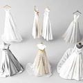 Elegant Long Wedding Dresses With Lace Design Displayed On Mannequins And Hangers