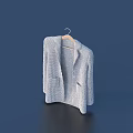 Light Gray Knitted Cardigan Hanging On Wooden Hanger Against Dark Blue Background