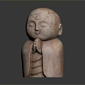 Pink Colored Man Statue with Hands in Prayer Position Closed Eyes on Neutral Gray Background