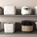 Various Modern Kitchen Appliances Displayed On Shelves In Kitchen