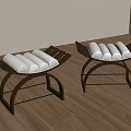 Two Modern Stools With Black Metal Frames And White Cushions On Wooden Floor