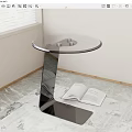 Modern Round Glass Top Side Table with Metal Base and Open Book on Marble Floor