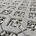 Urban Commercial Street Paved Ground With Hexagonal Concrete Grids And Small Stones