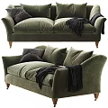 Green Velvet Two Seater Sofa with Dark Pillows and Black Throw Blanket and Wooden Legs