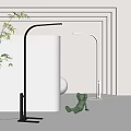 Modern Home Interior Floor Lamp With Sleek Black Silver Design And Green Plant