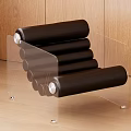 Leisure Chair With Black Cylindrical Cushions And Transparent Acrylic Frame Against Wooden Wall Floor