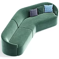 Green Velvet Curved Sectional Sofa With Gold Base And Decorative Pillows