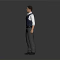 Man in Blue Vest White Shirt Gray Pants and Black Shoes Standing Against Gray Background