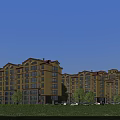 Modern Residential Building Exterior With Yellow Facade Red Roof Green Lawn Trees And Blue Sky