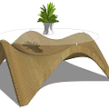Wooden Wave Shaped Coffee Table With Transparent Tabletop And White Vase Green Plant
