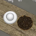 Rustic Wooden Table With White Ceramic Plate And Bowl Of Dark Fruits