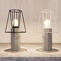 Modern Table Lamps With Concrete Base And Black White Cage Shades On Wooden Background