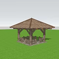 Outdoor Wooden Pavilion With Sloped Roof Surrounded By Trees And People On Grass