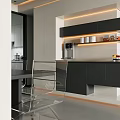 Modern Restaurant Dining Area With Open Concept Black Cabinets Clear Chairs And Lighting
