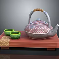 Traditional Patterned Teapot With Wooden Handle And Green Teacups On Red Wooden Tray