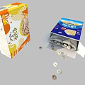 Two Cereal Boxes With Orange And Blue Packaging Open Box Showing Spilled Cereal Rings