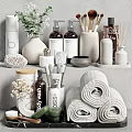 Essential Bathroom Accessories Including Rolled Towels Body Wash Bottles And Ceramic Containers