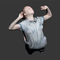 Child Performing Dance Move In Blue Denim Romper Barefoot On Gray Background