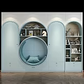 Light Blue Modern Wardrobe With Circular Seating Nook Arched Doors Open Shelves And Decorative Items