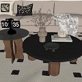 Modern Coffee Tables In Living Room With Black Tops Wooden Legs And Dried Flowers Vase