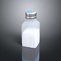 Clear Glass Salt Shaker With Perforated Lid Filled With White Table Salt For Kitchen Use