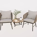 Wicker Chair and Table Set with Gray Cushions Small Round Table Green Plant and Books