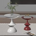 White and Red Round Accent Tables Featuring Vase Plant Gold Decor and Book