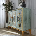 Modern Sideboard With Geometric Patterns Gold Trim Wooden Surface By Plant Vase And Wall Art