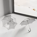 Silver Umbrellas as Daily Living Essentials Placed by Window with Snowy Outdoor View