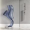 Streamlined Blue Sculpture on Marble Countertop with Vertical Striped Gray Wall and Metal Decorative Rod