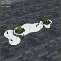 Modern Tea Break Area Featuring Curved White Tables Green Plants And Snacks