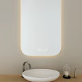 Modern Bathroom Mirror With LED Lighting Wall Mounted Above White Sink And Decorative Glass Vase