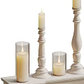 White Pedestal Candle Holders With Tall Columns Glass Shades And Lit Candles Design