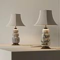 Two Modern Table Lamps With Stacked Marble Bases And Light Colored Shades On Display Stand 3d model