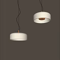 Modern Minimalist Two White Pendant Lights Hanging On Gray Interior Wall With Warm Glow