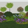 Colorful Garden Landscape With Various Flowers Bushes And Trees On Green Grass