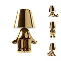 Modern Golden Table Lamp With Sculptural Base And Unique Shade Design