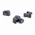 Three Black Digital Cameras Shown From Various Angles With Lenses Attached 3d model