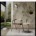 Modern Accent Chair With Wooden Frame Leather Seat Near Large Window Green View And Marble Wall