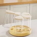 Rotating Spice Containers With Transparent Bottles White Lids And Yellow Base For Kitchen Storage