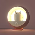 Round Design Table Lamp With White Cat Shaped Figure And Warm Cozy Light