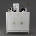 White Shoe Cabinet With Golden Handles Drawers And Decorative Items On Top